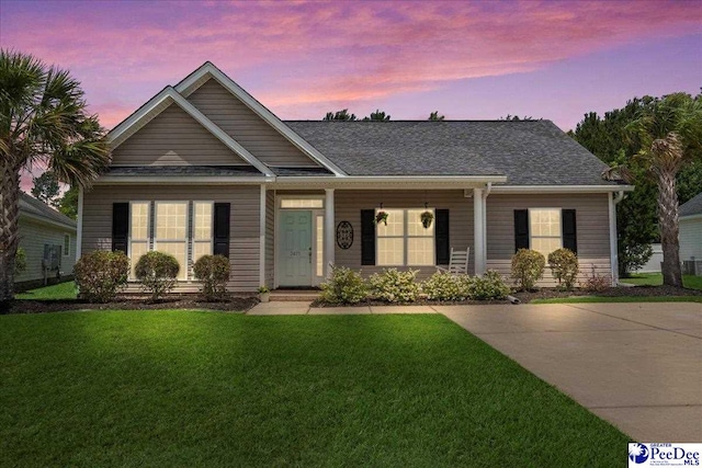 3471 Sweetgrass Dr, Florence, SC 29501 - view of front facade with a lawn and roof with shingles