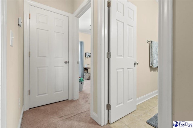 3471 Sweetgrass Dr, Florence, SC 29501 - hallway with baseboards, light carpet, and light tile patterned floors