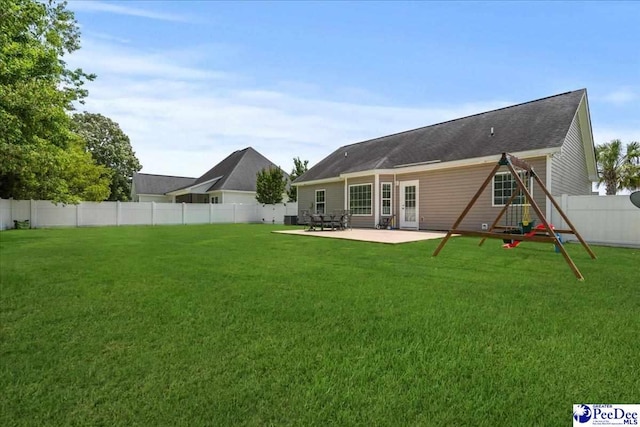 3471 Sweetgrass Dr, Florence, SC 29501 - back of property with a patio area and a playground