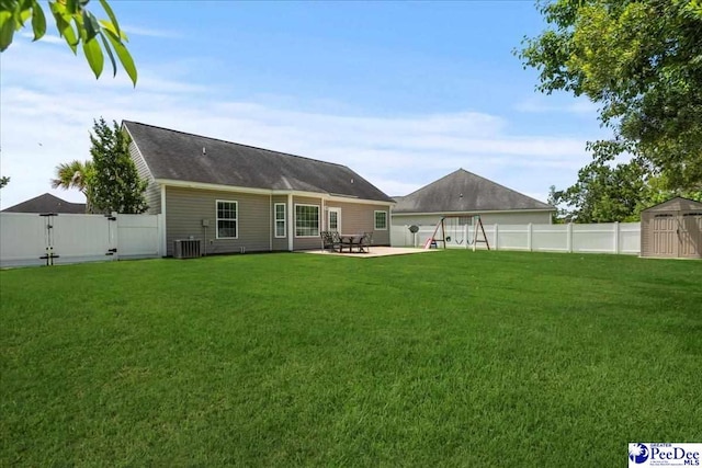 3471 Sweetgrass Dr, Florence, SC 29501 - rear view of property with a gate, a patio, and central AC