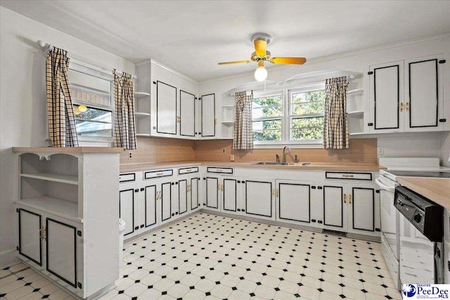 kitchen with light floors, white dishwasher, a sink, light countertops, and open shelves