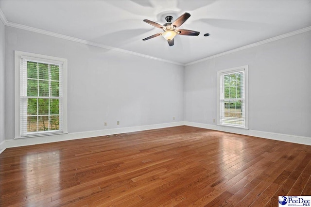 unfurnished room featuring ornamental molding, wood-type flooring, and ceiling fan