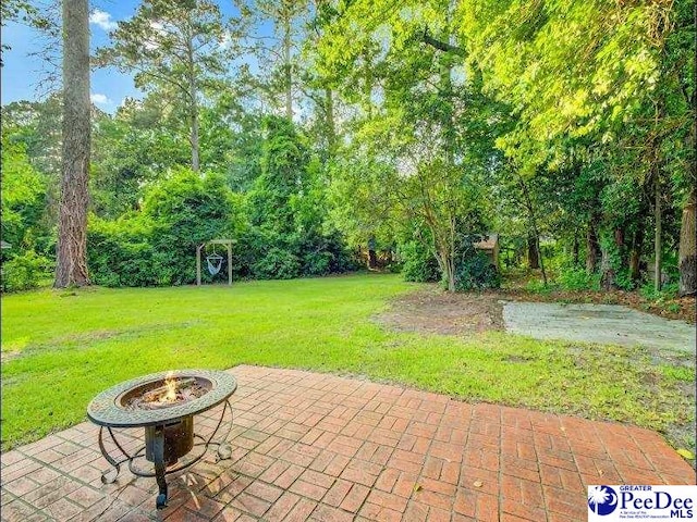 1417 Woods Rd, Florence, SC 29501 - view of patio with an outdoor fire pit