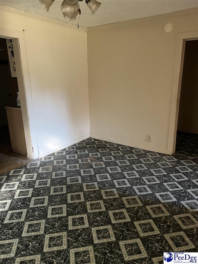 spare room featuring a textured ceiling