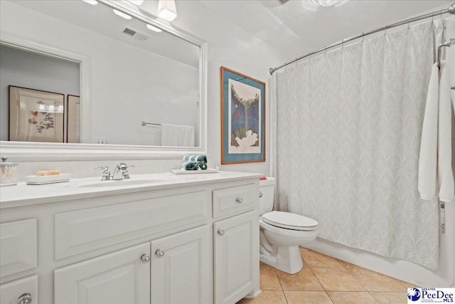 bathroom featuring visible vents, shower / tub combo with curtain, tile patterned flooring, vanity, and toilet
