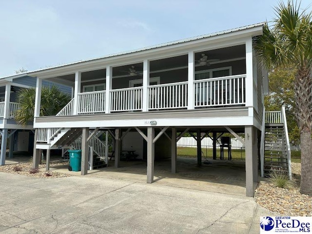 view of front of house featuring ceiling fan and covered porch