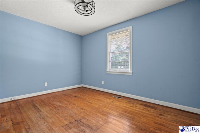 3712 E Hoyt St, Florence, SC 29506 - unfurnished room with wood finished floors and baseboards
