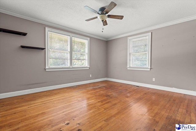 3712 E Hoyt St, Florence, SC 29506 - spare room featuring healthy amount of natural light, hardwood / wood-style flooring, a textured ceiling, ceiling fan, and ornamental molding