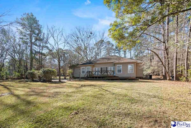 exterior space with a yard and a deck