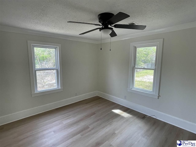 929 E Home Ave, Hartsville, SC 29550 - unfurnished room with a textured ceiling and plenty of natural light