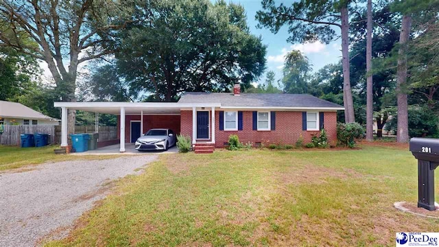 single story home featuring a carport and a front yard