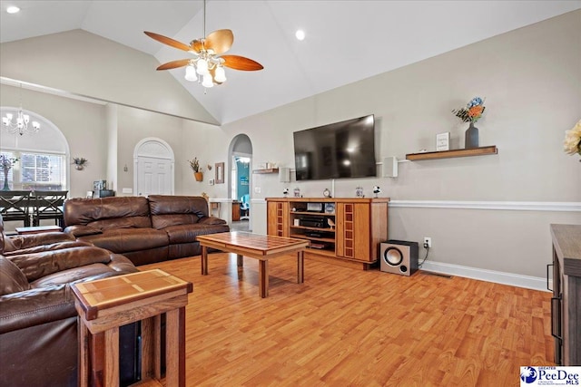 1416 Nottingham Dr, Hartsville, SC 29550 - living room with high vaulted ceiling, ceiling fan with notable chandelier, and light hardwood / wood-style floors