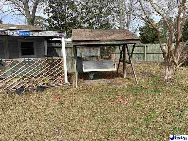 view of outdoor structure featuring a lawn