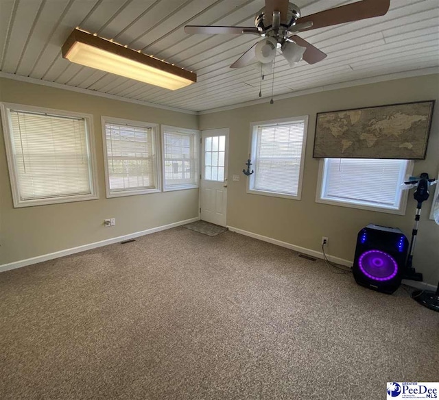 unfurnished sunroom with ceiling fan and wood ceiling