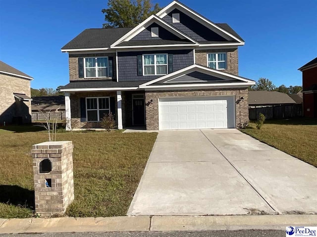 craftsman-style home with a garage and a front yard