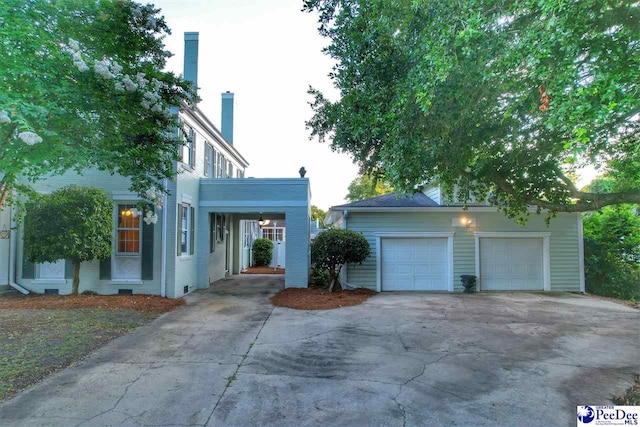 view of front of property with a garage