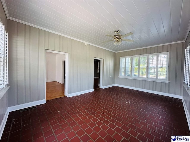 unfurnished sunroom featuring ceiling fan