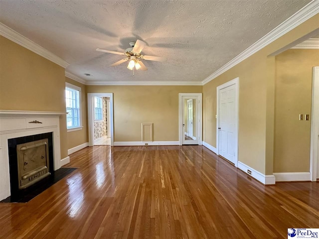 unfurnished living room with hardwood / wood-style floors, crown molding, and ceiling fan