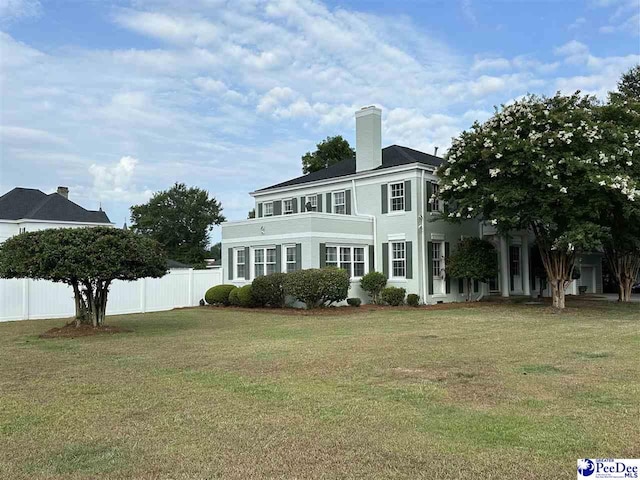 back of house featuring a yard