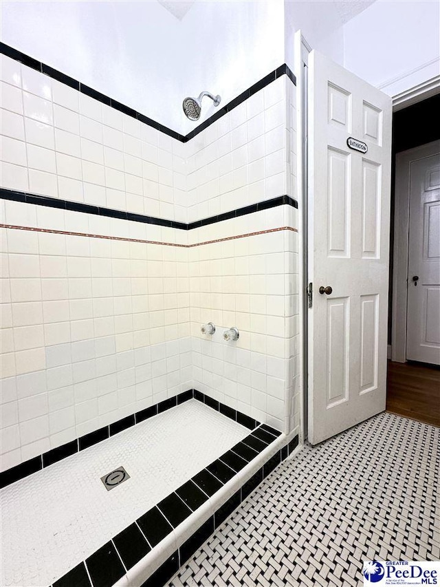 bathroom with tiled shower