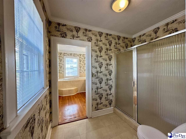 bathroom with ornamental molding, toilet, tile patterned floors, and a shower with shower door