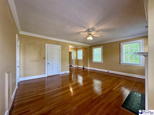 spare room with crown molding, ceiling fan, dark hardwood / wood-style flooring, and a textured ceiling