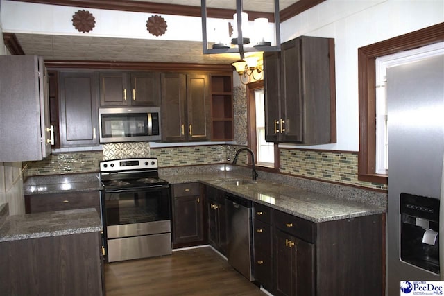 114 Law St, Darlington, SC 29532 - kitchen with stainless steel appliances, a sink, decorative backsplash, open shelves, and dark wood finished floors