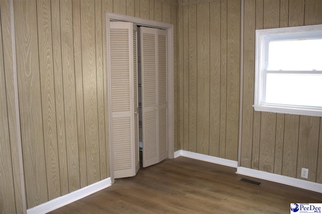 114 Law St, Darlington, SC 29532 - unfurnished bedroom featuring baseboards, visible vents, dark wood finished floors, and a closet