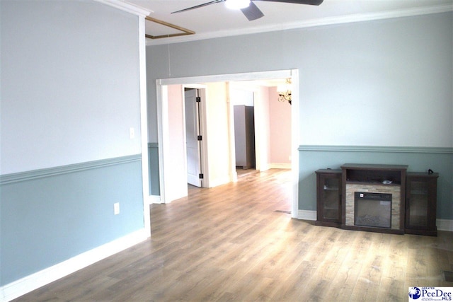 114 Law St, Darlington, SC 29532 - unfurnished living room with baseboards, wood finished floors, a ceiling fan, and crown molding