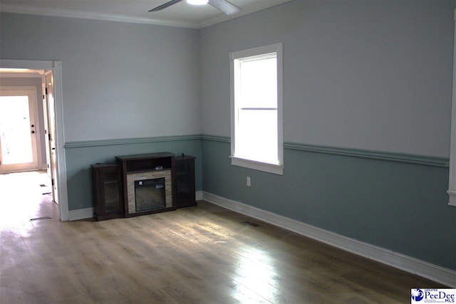 114 Law St, Darlington, SC 29532 - unfurnished living room featuring crown molding, a fireplace, a ceiling fan, and wood finished floors