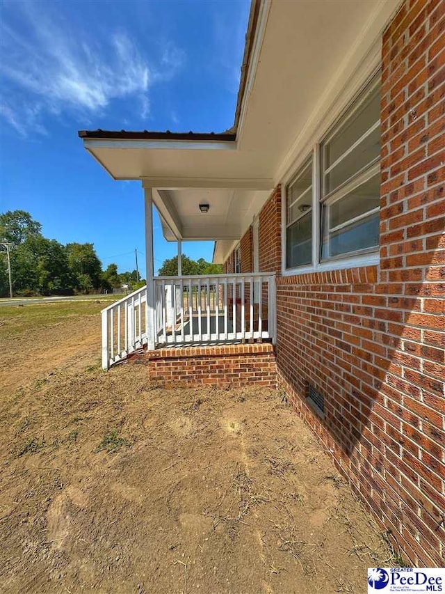 view of home's exterior with covered porch