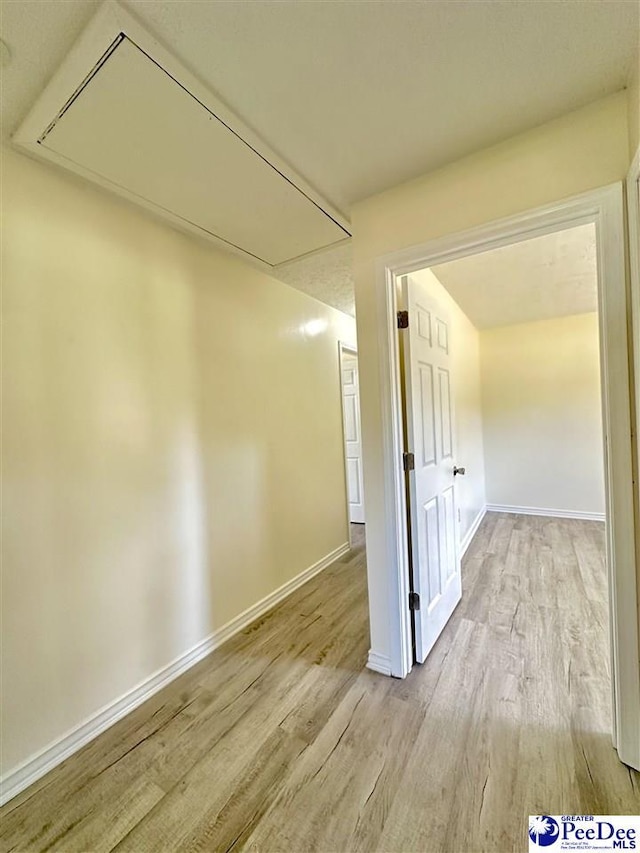 hallway with light wood-type flooring