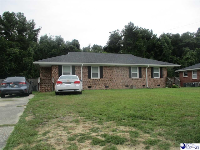 ranch-style house featuring a front yard