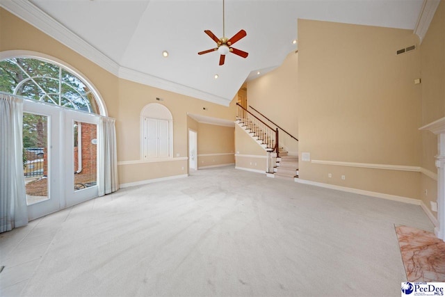 unfurnished living room with french doors, high vaulted ceiling, light carpet, ornamental molding, and ceiling fan