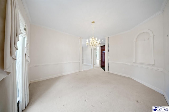 spare room with an inviting chandelier, light carpet, and ornamental molding