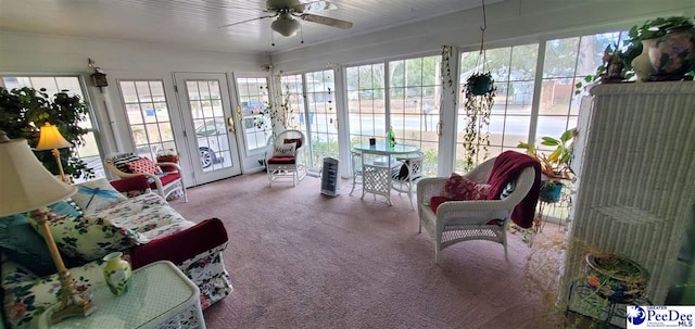 sunroom / solarium with plenty of natural light and ceiling fan