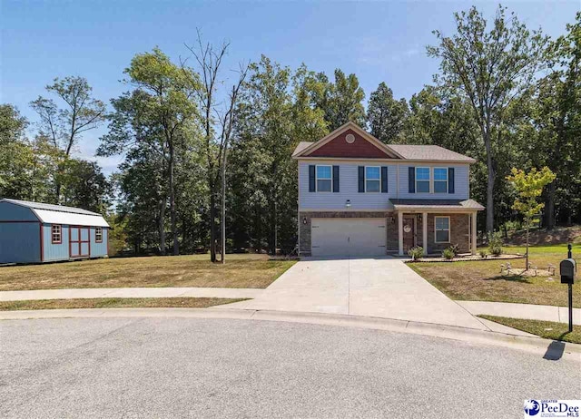 view of front of property featuring a garage, a front yard, and a storage unit