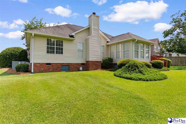2122 Twin Bridge Dr, Florence, SC 29505 - back of house featuring crawl space, a chimney, and roof with shingles