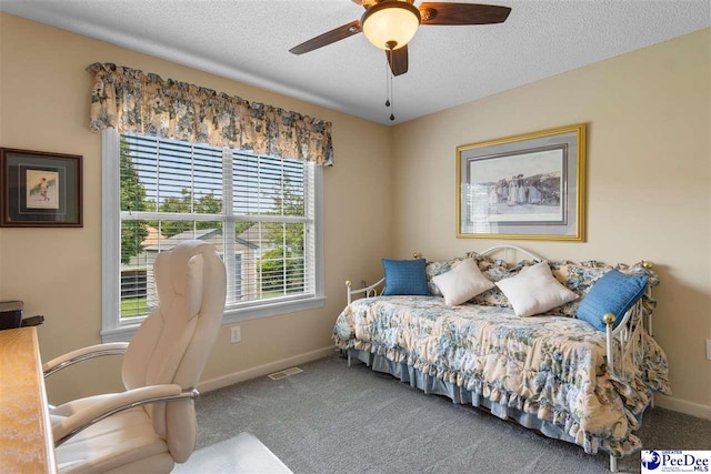 2122 Twin Bridge Dr, Florence, SC 29505 - carpeted bedroom featuring a textured ceiling and a ceiling fan