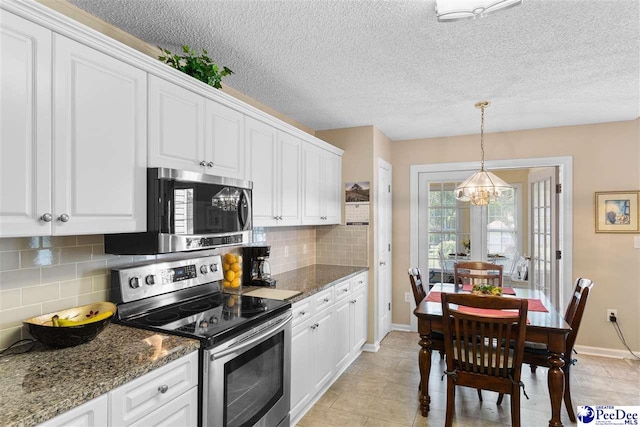 2122 Twin Bridge Dr, Florence, SC 29505 - kitchen featuring appliances with stainless steel finishes, a chandelier, white cabinetry, and a textured ceiling