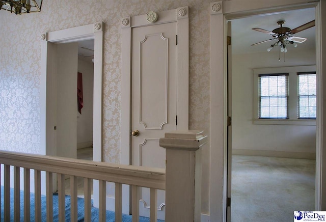 interior space featuring ceiling fan