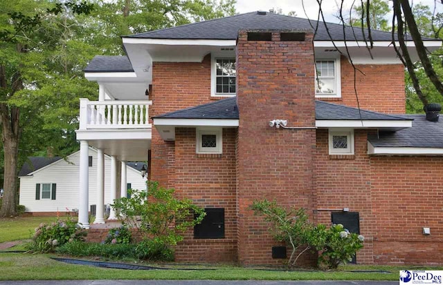 rear view of house with a balcony