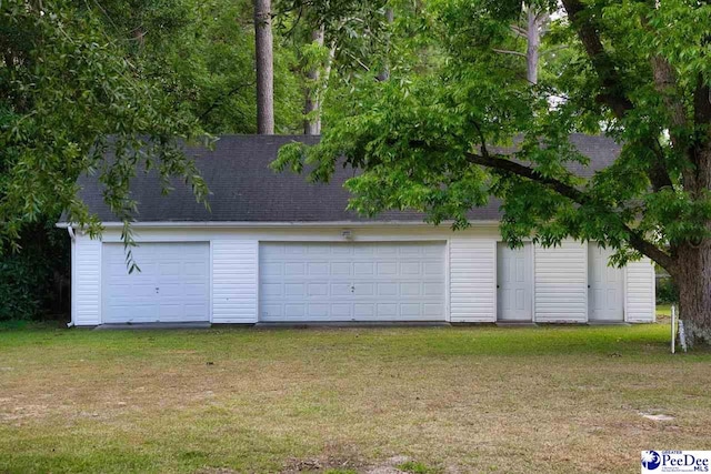 garage with a lawn