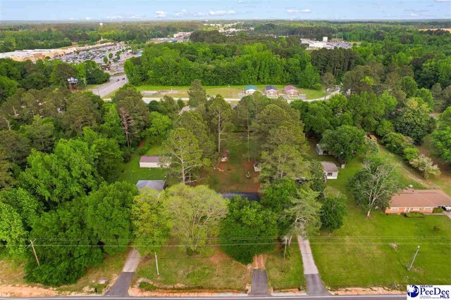 bird's eye view featuring a wooded view