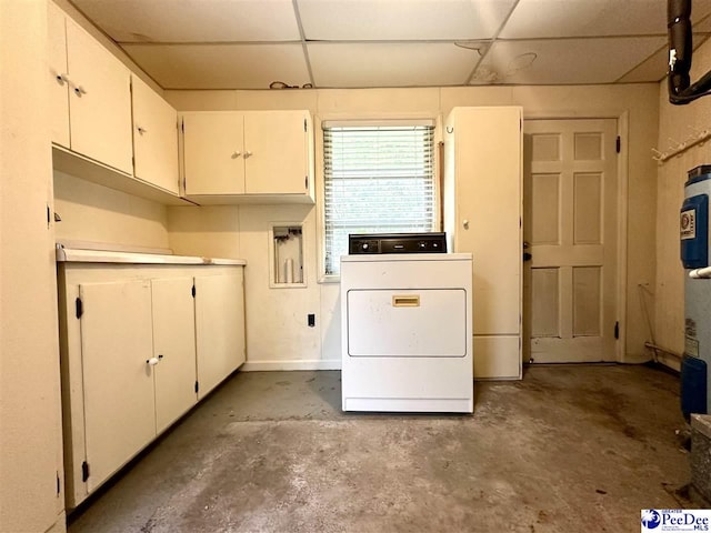 washroom featuring cabinets and washer / dryer