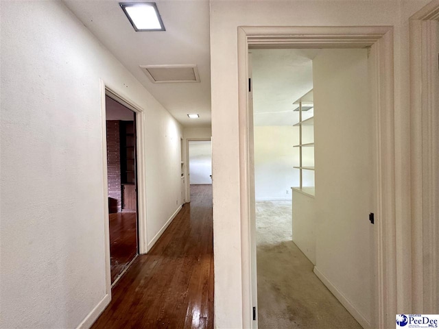 corridor featuring dark hardwood / wood-style flooring