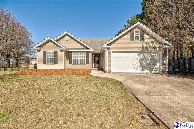 ranch-style house featuring a front yard, concrete driveway, and fence