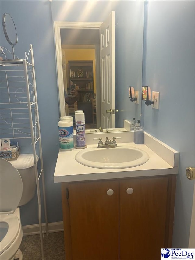 bathroom with vanity and toilet