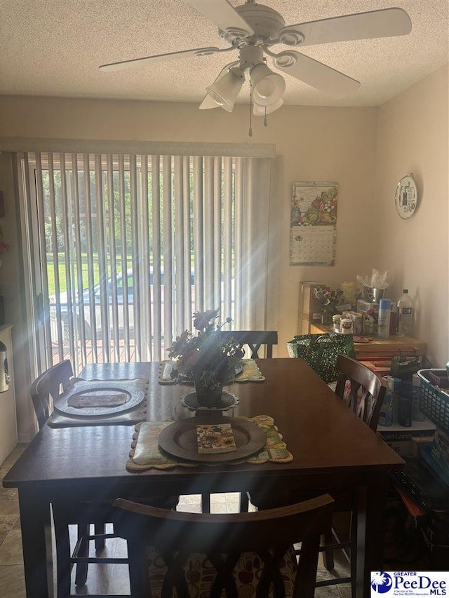 dining space with a textured ceiling