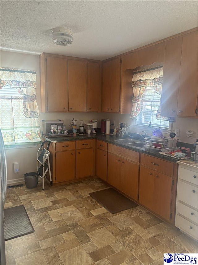 kitchen featuring a textured ceiling